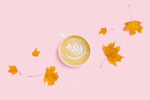 cup of coffee with autumn leaves