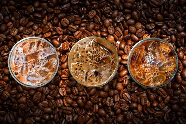 Cup of coffee with beans on table