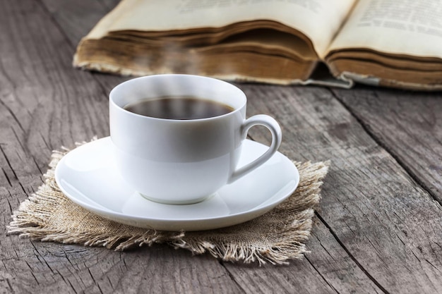 Cup of coffee with book