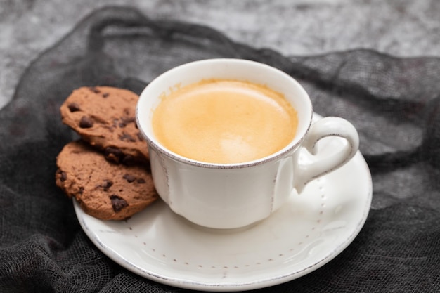 cup of coffee with chocolate cookies with chocolate chips