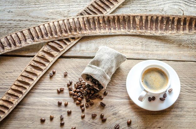 Cup of coffee with coffee beans