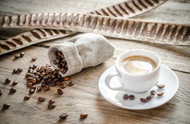 Cup of coffee with coffee beans