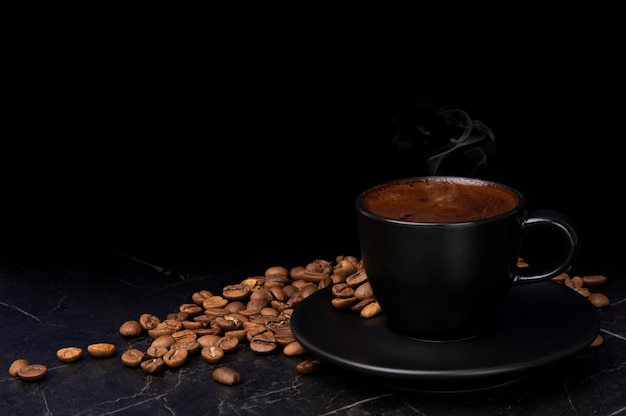 A cup of coffee with coffee beans