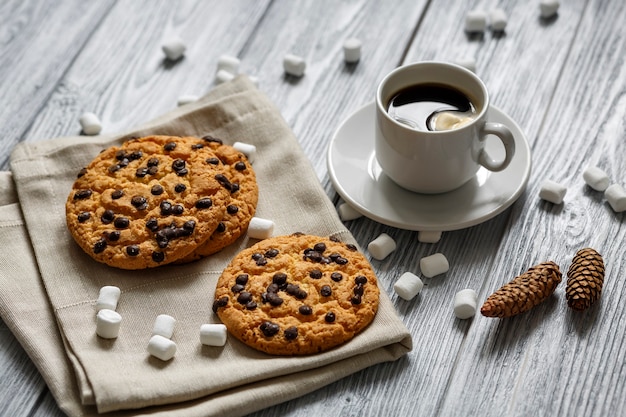 Cup of coffee with cookies, fir cones, food, marshmallows