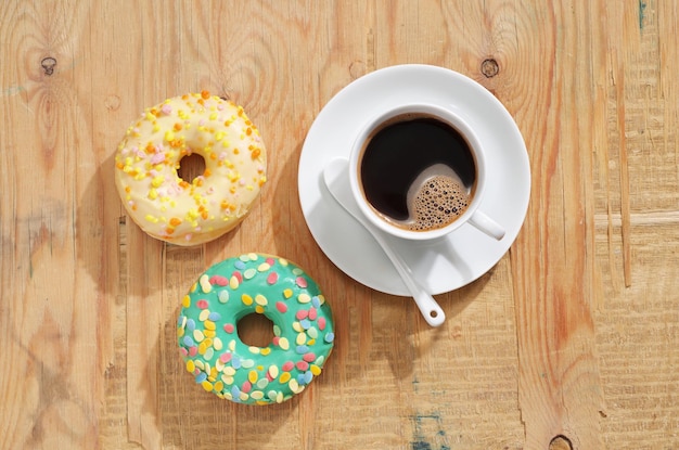 Cup of coffee with donuts