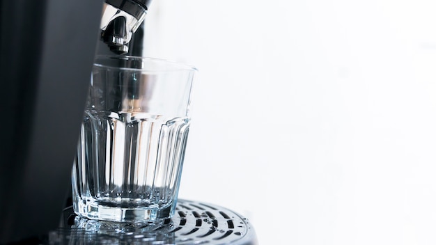 Cup of coffee with drop of water from bean to coffee machine in cappuccino and espresso