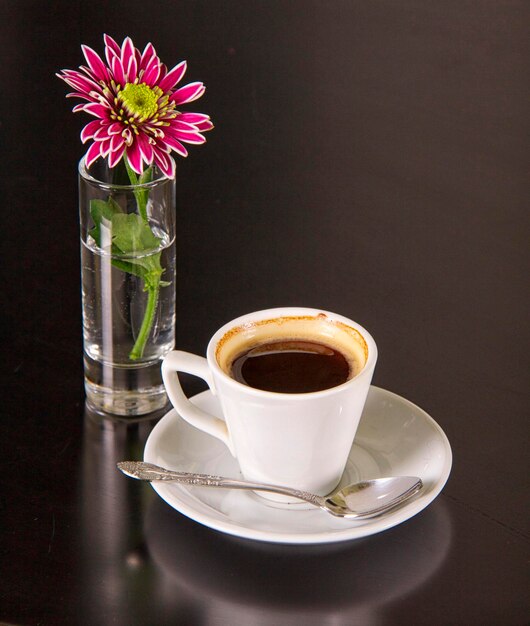 Cup of coffee with flowers