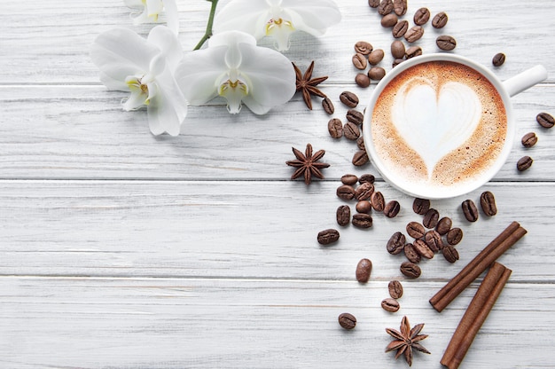 A cup of coffee with heart background