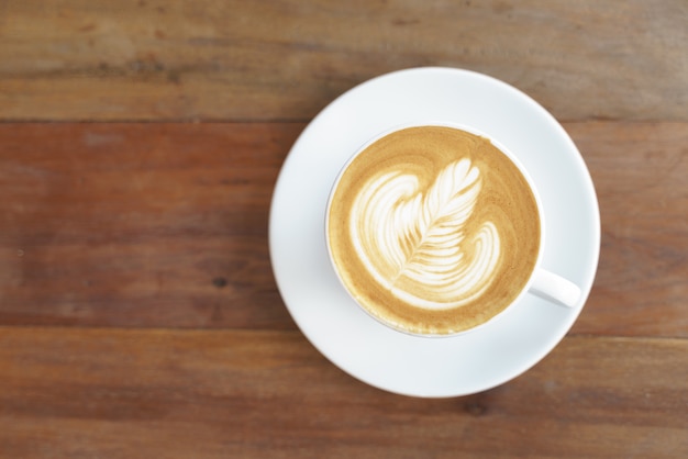 Photo cup of coffee with latte art pattern