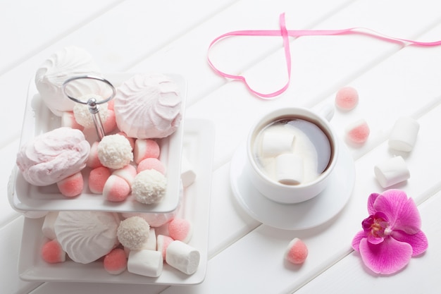Cup of coffee with marshmallow for valentine's day