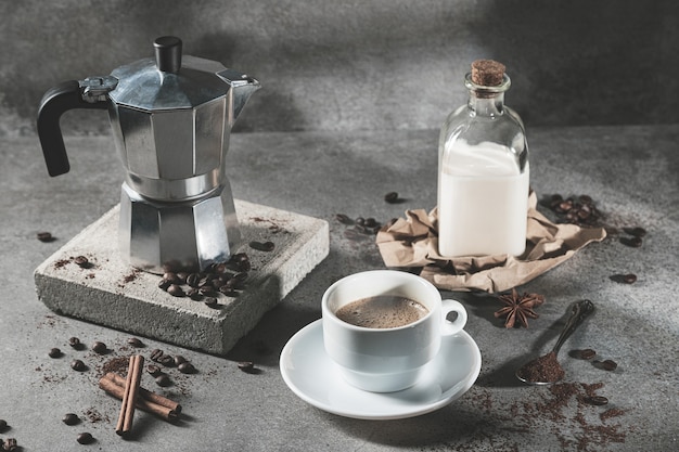 Cup of coffee with milk  on dark background.