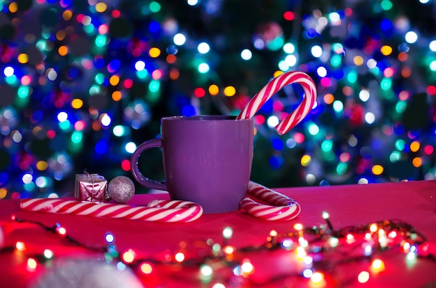 Cup of coffee with on red background. Christmas beatiful still life.