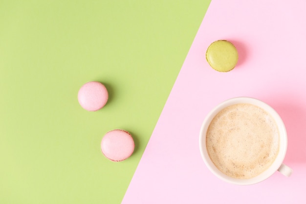 Cup of coffee with sweet macaroons