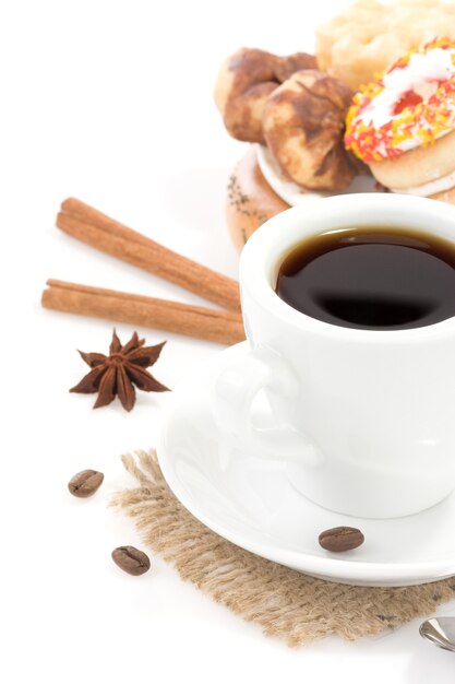 Cup of coffee with sweets on white