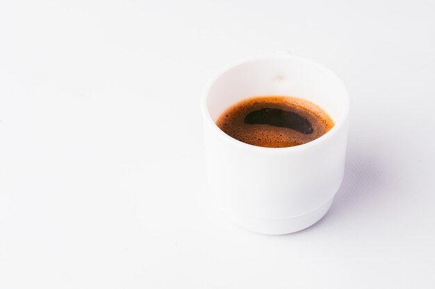 A cup of coffee with the word espresso on it