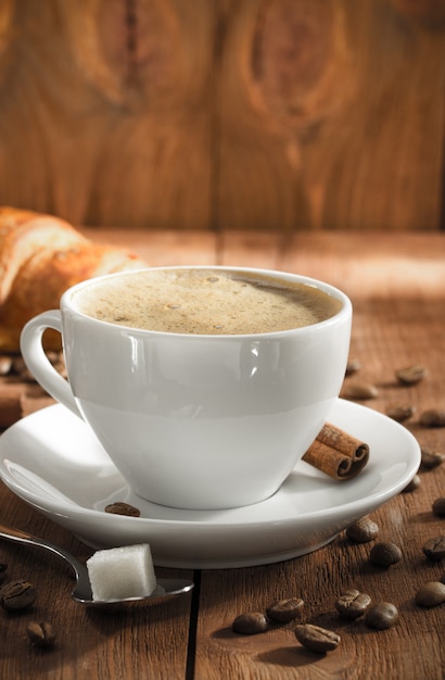 Cup of coffee on wood