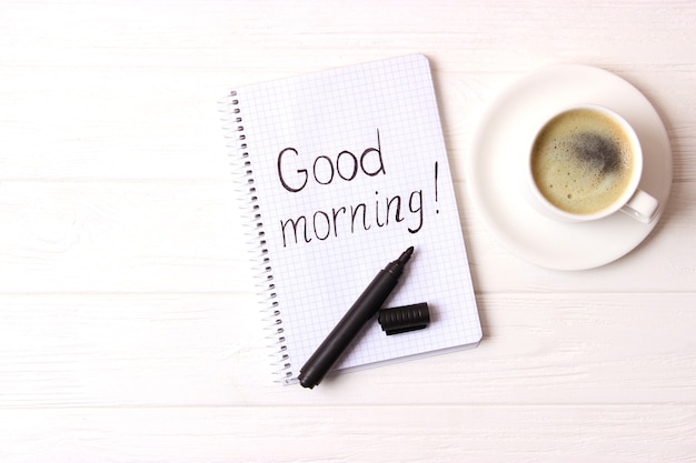 Cup of coffee on wooden background top view. Good morning. Have a nice day. High quality photo