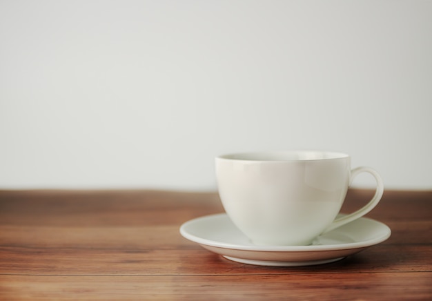 A cup of coffee on wooden background