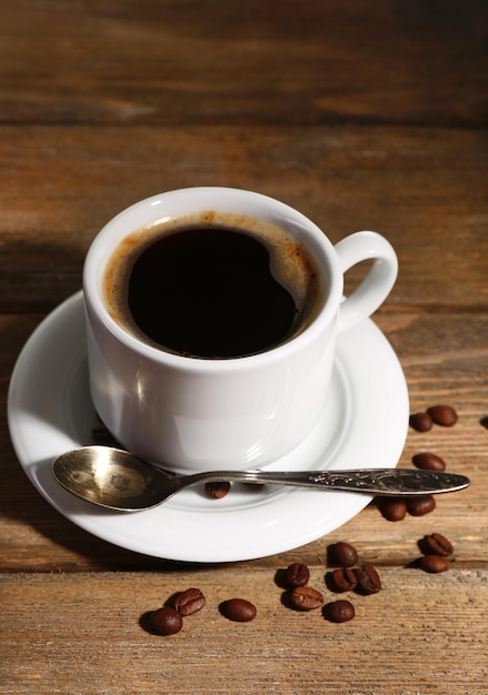 Cup of coffee on wooden background