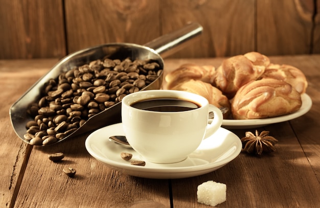 Cup of coffee on wooden surface