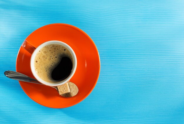 Cup of coffee on wooden surface