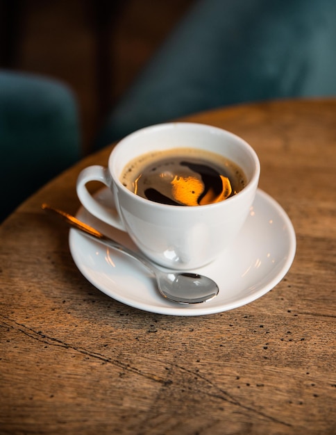 cup of coffee on the wooden table in the cafe