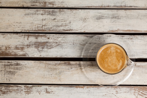 Cup of coffee on wooden table