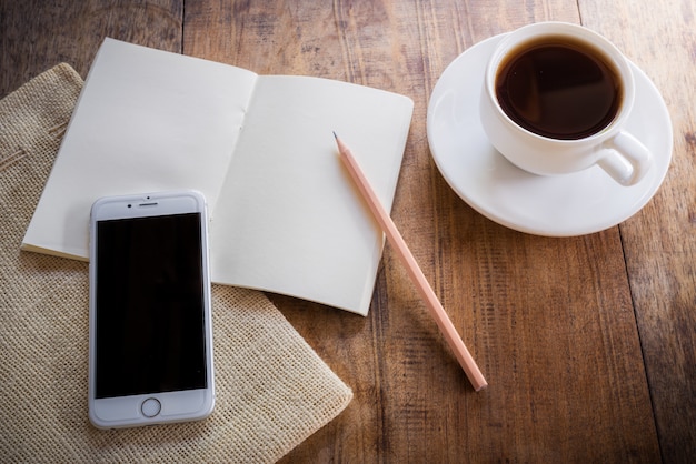 Cup of coffee on a wooden table