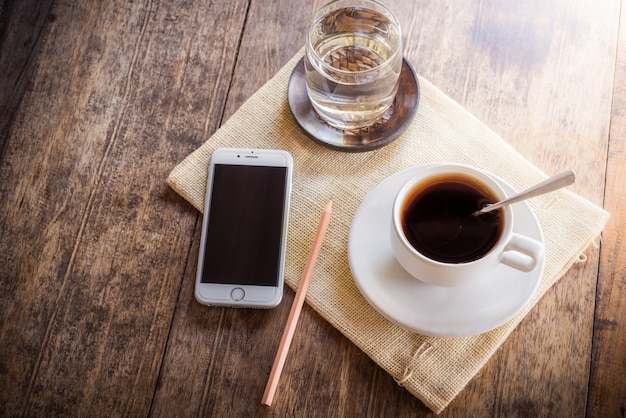 Cup of coffee on a wooden table