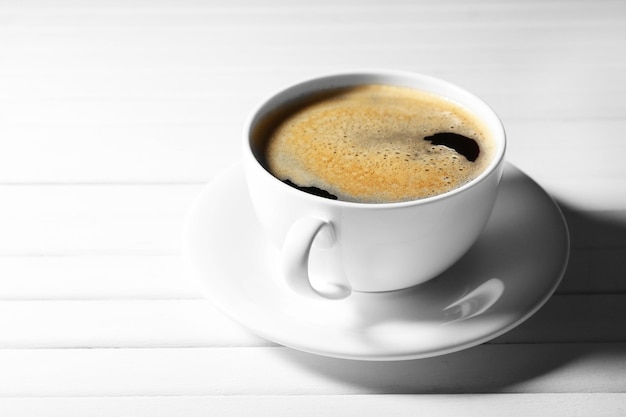 Cup of coffee on wooden table