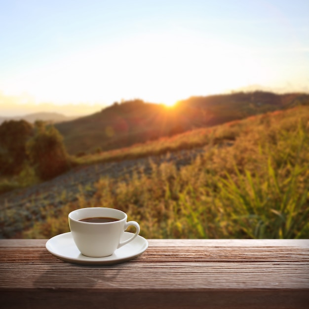 Cup of coffee on a wooden table.