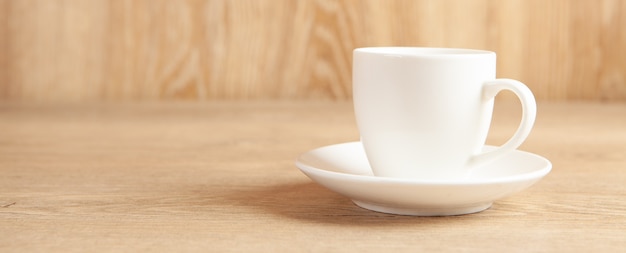 A cup of coffee on a wooden table