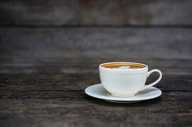 Cup of coffee on a wooden table