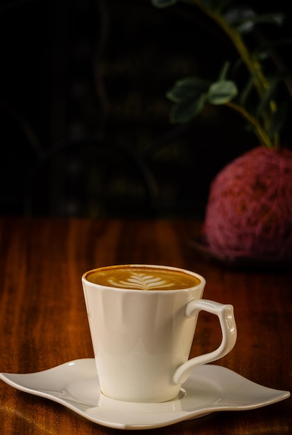 cup of coffee on wooden table