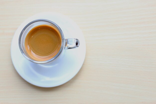 Cup of coffee on wooden table