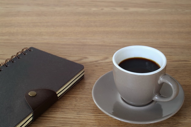 A cup of coffee on working table.                               