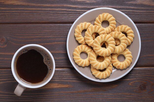 Cup of cookies and shortbread cookies on the table