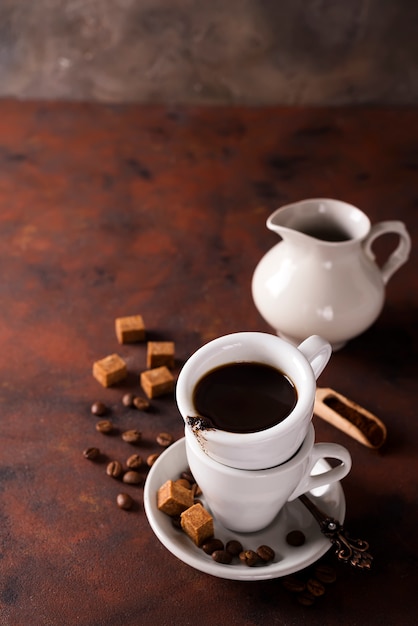 Cup on a cup with espresso coffee on a dark background