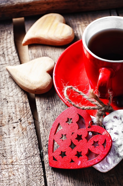 Cup decorated with wooden hearts