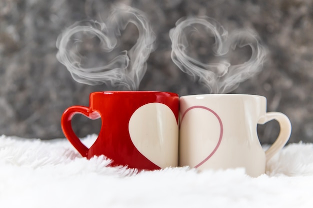 Cup drink for Breakfast in the hands of lovers. Selective focus.