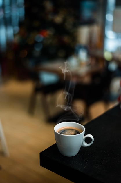 Cup of espresso coffee on dark background
