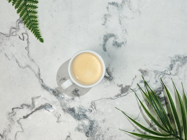 A cup of espresso on a marble table