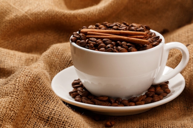 Cup filled with coffee beans