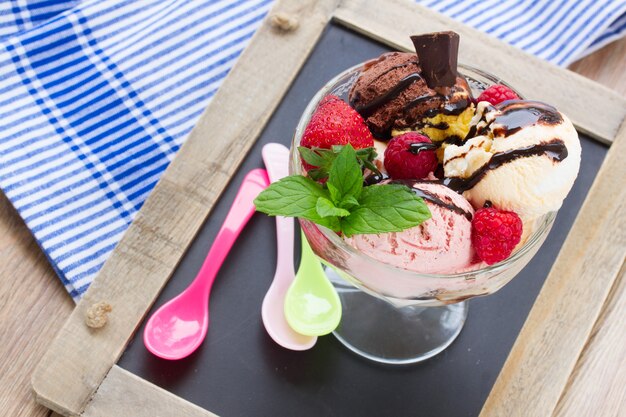 Cup of fresh mixed  icecream served on table