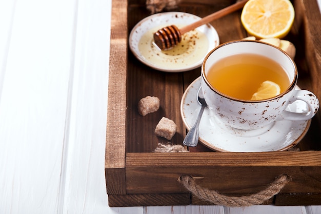 Cup of ginger tea with honey