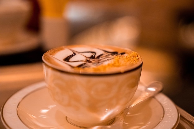 Cup of Golden Cappuccino in Abu Dhabi. Coffee with gold decoration. UAE. United Arab Emirates.