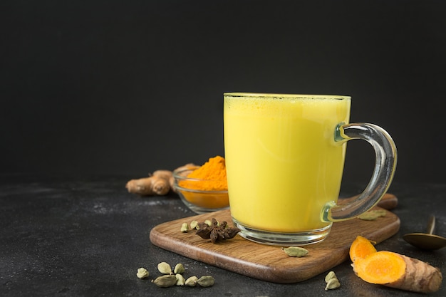 Cup of golden turmeric latte milk