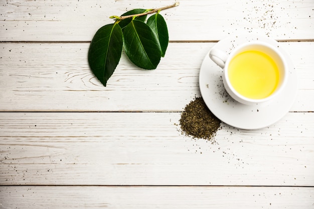 Cup of herbal tea on table