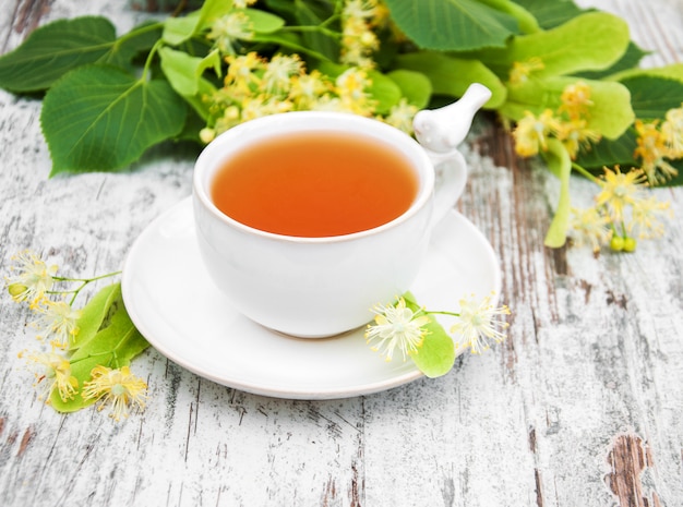 Cup of herbal tea with linden flowers