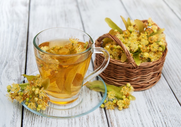 Cup of herbal tea with linden flowers